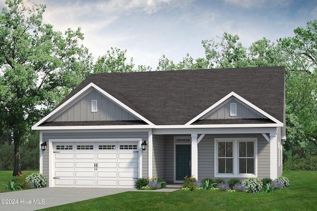 view of front of house featuring a front yard and a garage