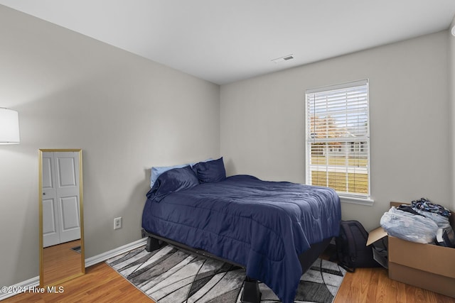 bedroom featuring wood-type flooring