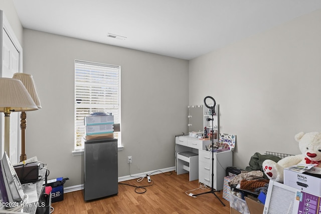 office space with wood-type flooring