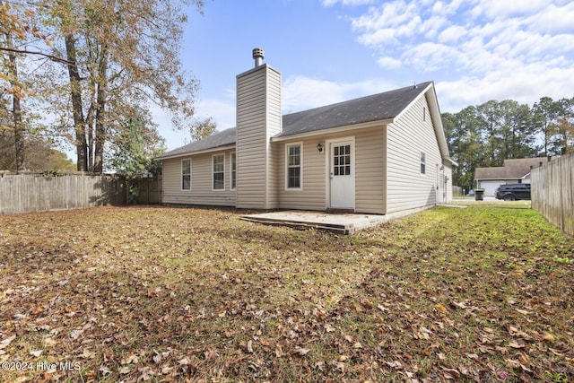 back of house with a patio area