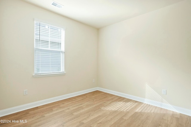 unfurnished room with light hardwood / wood-style floors