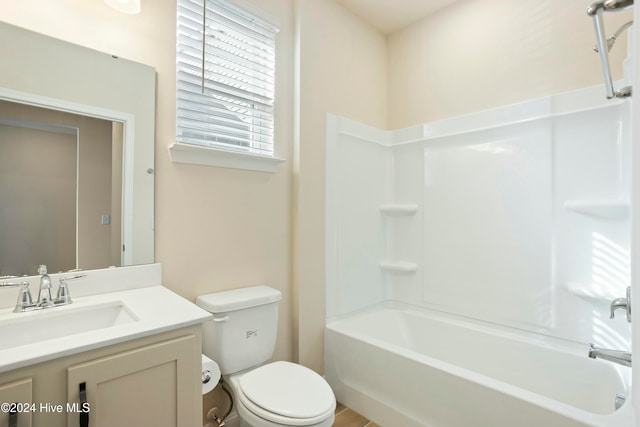 full bathroom with vanity, shower / bath combination, and toilet