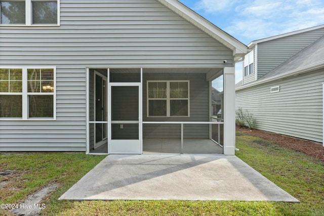 rear view of property featuring a patio