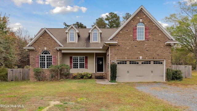 view of front property with a front yard and a garage