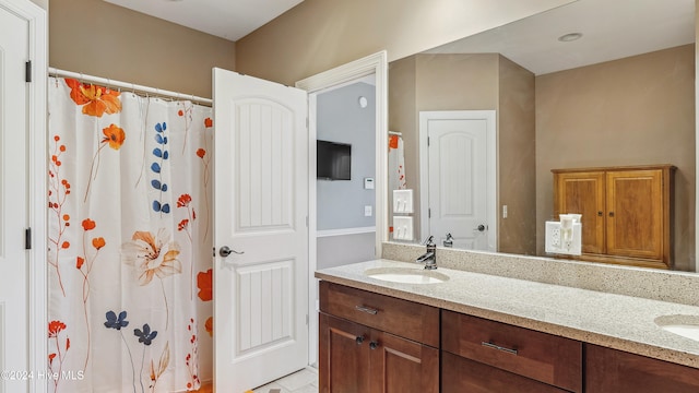 bathroom with tile patterned flooring and vanity