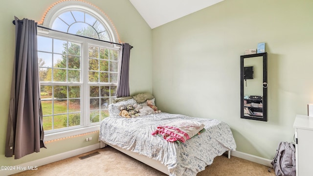 carpeted bedroom featuring lofted ceiling