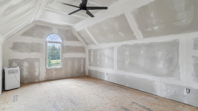 additional living space featuring ceiling fan and vaulted ceiling