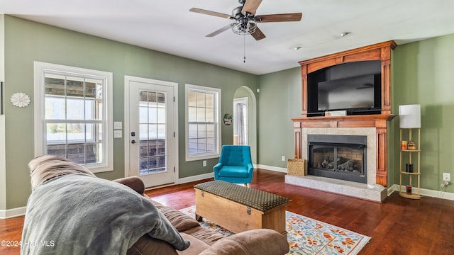 living room featuring ceiling fan and hardwood / wood-style floors