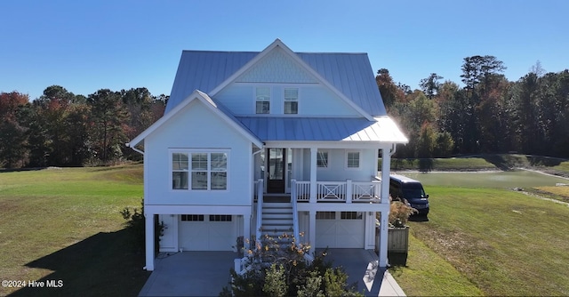 view of front of home with a porch and a garage