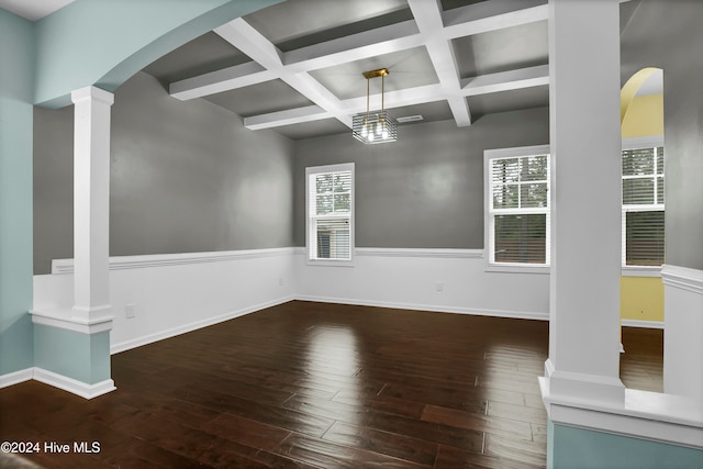 spare room featuring beamed ceiling, dark hardwood / wood-style flooring, ornate columns, and coffered ceiling