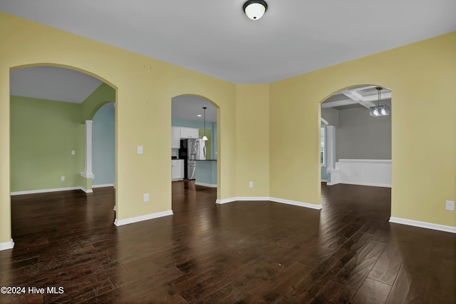 unfurnished room featuring dark hardwood / wood-style floors