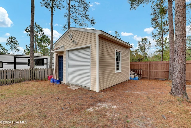 view of outbuilding featuring a garage