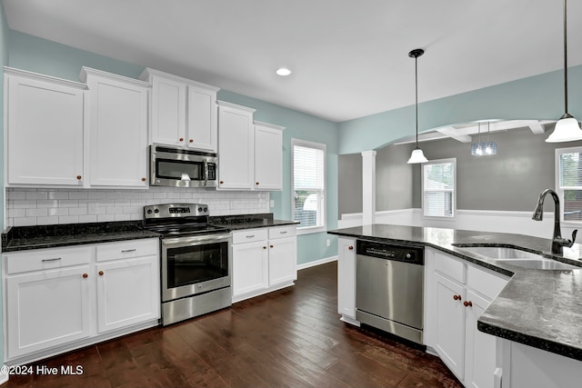 kitchen with white cabinets, sink, and stainless steel appliances