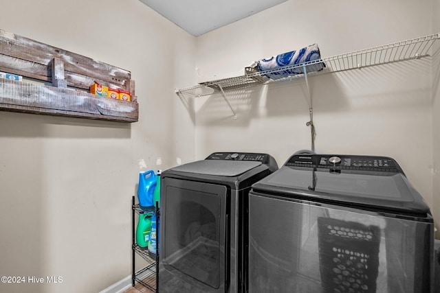 clothes washing area featuring washing machine and dryer