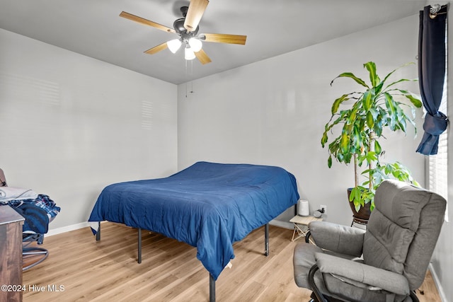 bedroom featuring light hardwood / wood-style flooring and ceiling fan