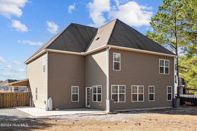 back of house with a patio and central air condition unit