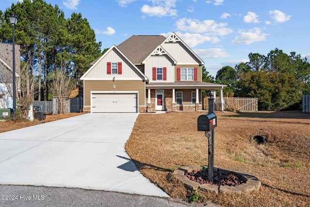 craftsman-style house with covered porch and a garage