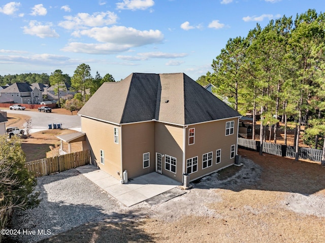 back of house with a patio