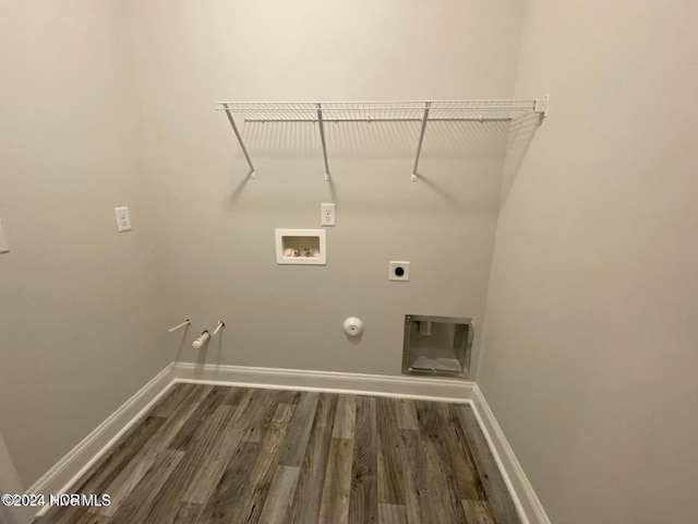 laundry area with electric dryer hookup, hookup for a gas dryer, dark hardwood / wood-style flooring, and washer hookup