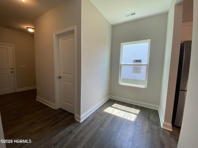 corridor with dark wood-type flooring