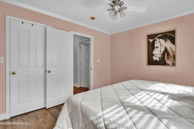 bedroom with ceiling fan, wood-type flooring, and ornamental molding