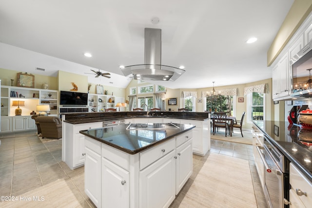 kitchen featuring white cabinets, a kitchen island, and appliances with stainless steel finishes