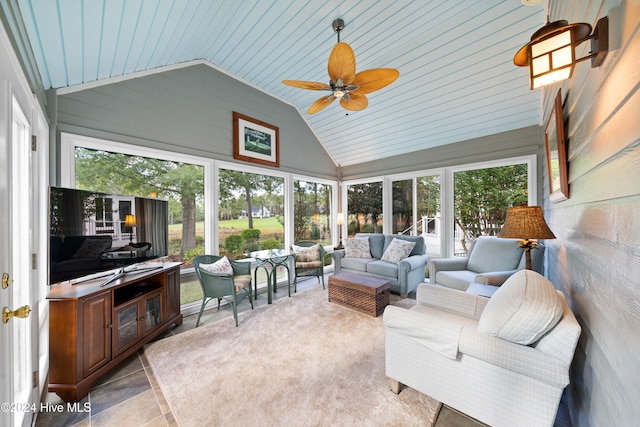 sunroom featuring ceiling fan, a healthy amount of sunlight, wooden ceiling, and vaulted ceiling