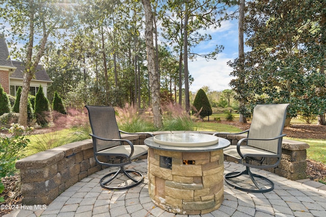 view of patio featuring a fire pit