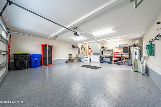 garage featuring ceiling fan, water heater, and a garage door opener