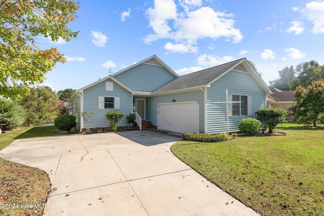 view of front of house with a garage and a front lawn