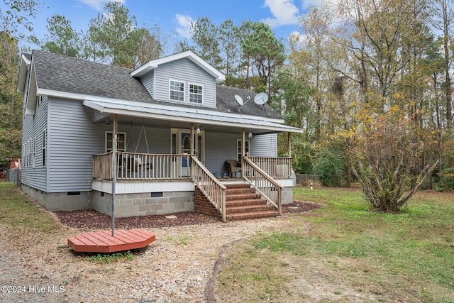 view of front of house with a front lawn and covered porch