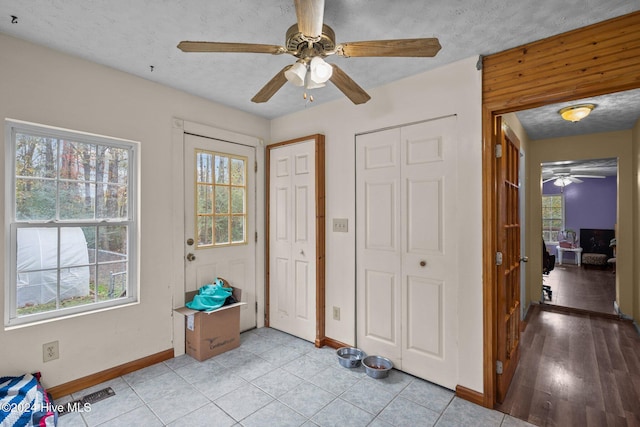 16200 US Highway 421, Burgaw, NC 28425 - foyer featuring a ceiling fan, baseboards, healthy amount of natural light, and a textured ceiling