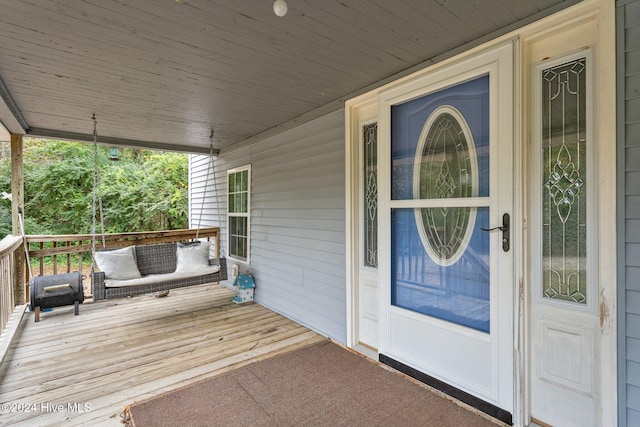 property entrance with covered porch