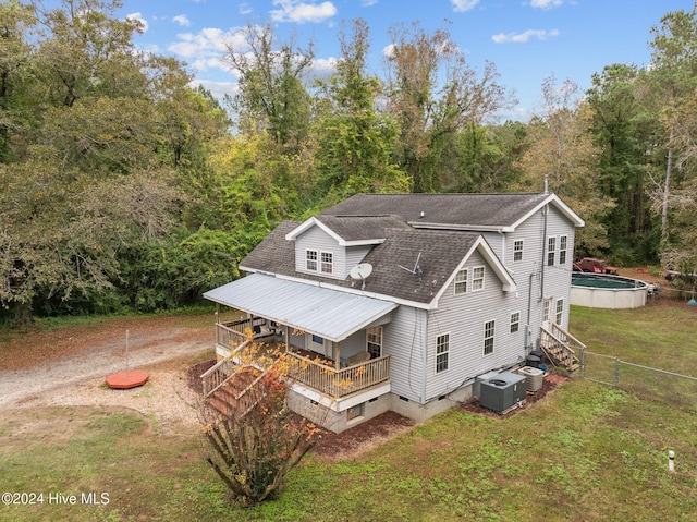 16200 US Highway 421, Burgaw, NC 28425 - back of property featuring central AC unit, a shingled roof, a view of trees, and a wooden deck