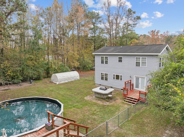 16200 US Highway 421, Burgaw, NC 28425 - rear view of property featuring a deck, an outdoor pool, and a shingled roof