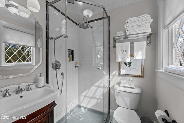 505 Broad St, Oriental, NC 28571 - bathroom featuring toilet, ornamental molding, vanity, and a stall shower