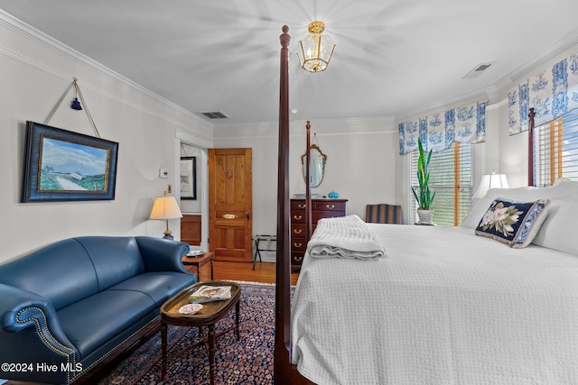 505 Broad St, Oriental, NC 28571 - bedroom featuring crown molding and wood finished floors