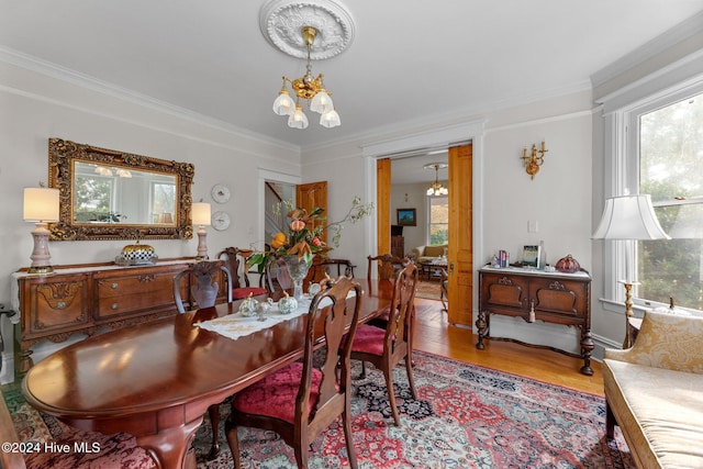 505 Broad St, Oriental, NC 28571 - dining room featuring a chandelier, ornamental molding, and wood finished floors