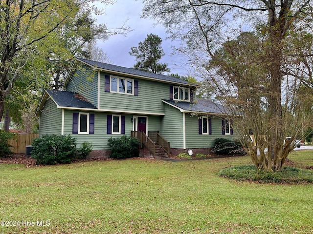 view of property featuring a front yard