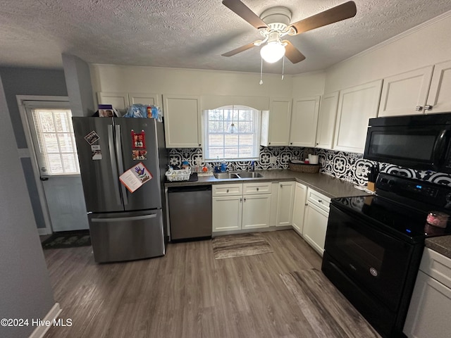 kitchen featuring black appliances, ceiling fan, tasteful backsplash, dark hardwood / wood-style flooring, and white cabinetry