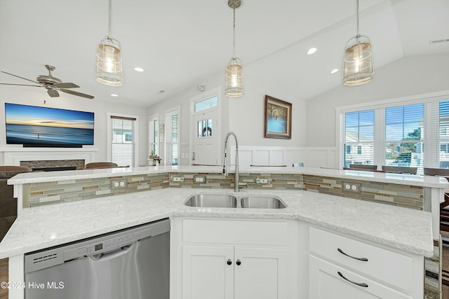 kitchen featuring white cabinetry, ceiling fan, plenty of natural light, and stainless steel dishwasher