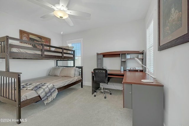 bedroom featuring ceiling fan and light colored carpet