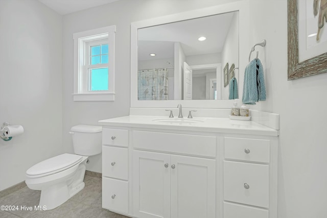 bathroom with tile patterned flooring, vanity, curtained shower, and toilet