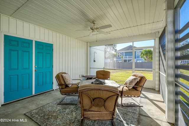 sunroom / solarium with ceiling fan