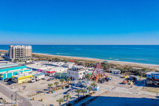 bird's eye view featuring a view of the beach and a water view