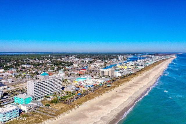 bird's eye view featuring a view of the beach and a water view