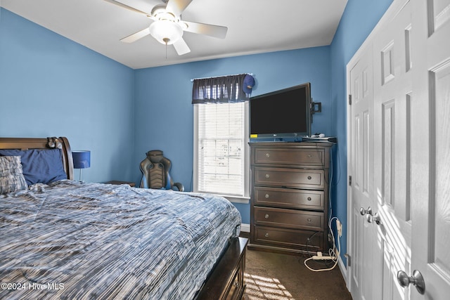 carpeted bedroom with ceiling fan