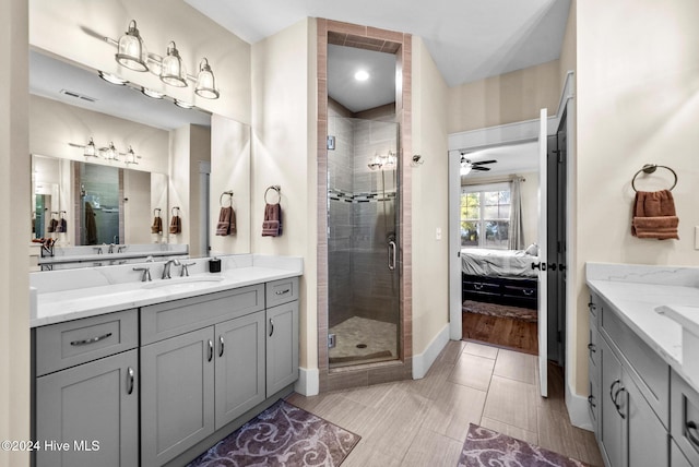 bathroom featuring ceiling fan, wood-type flooring, walk in shower, and vanity