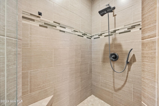 bathroom with basketball court and tiled shower