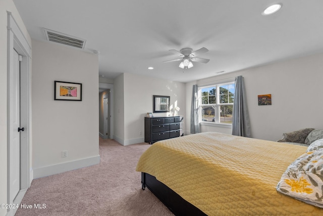 carpeted bedroom featuring ceiling fan